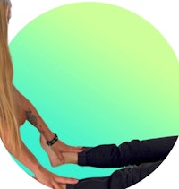a woman with long hair is doing a yoga pose